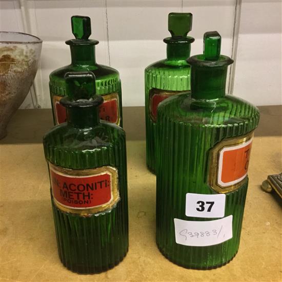 Collection of green glass chemists bottles